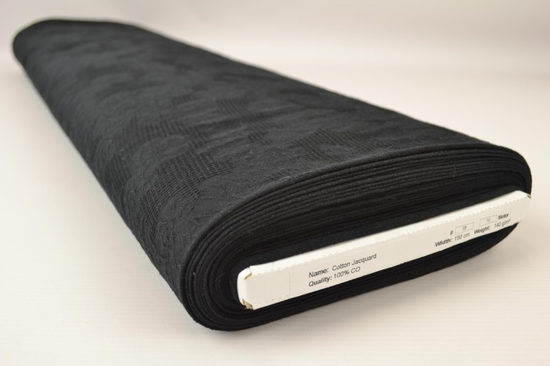 Baumwolljacquard schwarz, Rolle