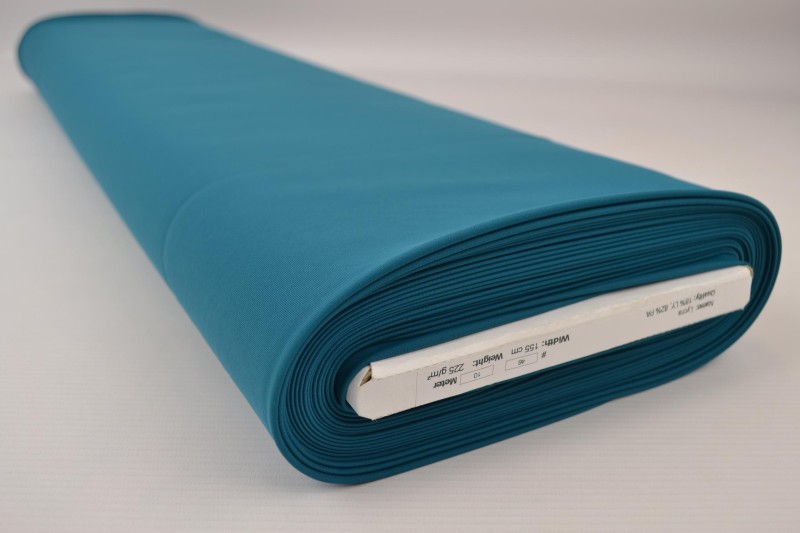 Lycra dunkelpetrol, Rolle